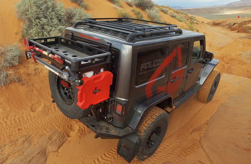 TeraFlex Alta cargo rack holding a red fuel pack on the rear of a Jeep Wrangler JK in the desert