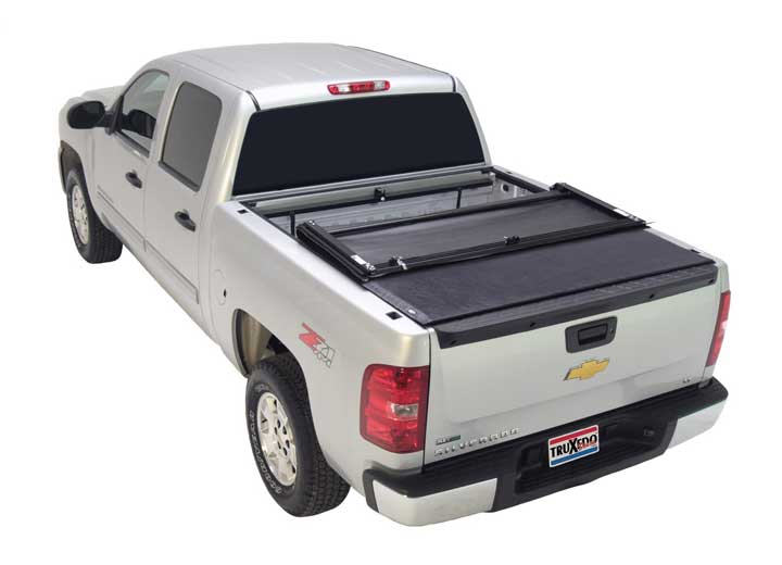 TruXedo Deuce soft folding tonneau cover folded flat at the bulkhead over the bed of a pickup truck