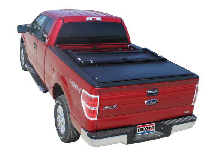 TruXedo Deuce soft folding tonneau cover folded flat at the bulkhead over the bed of a pickup truck
