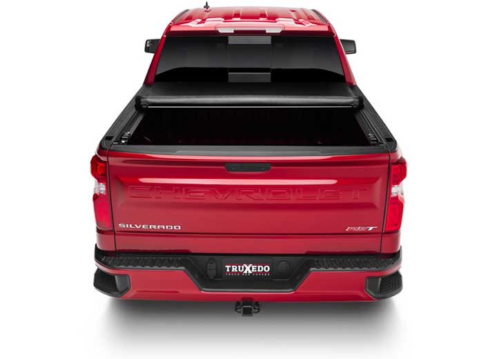 TruXedo Deuce soft folding tonneau cover folded partway open over the bed of a pickup truck, straight rear view