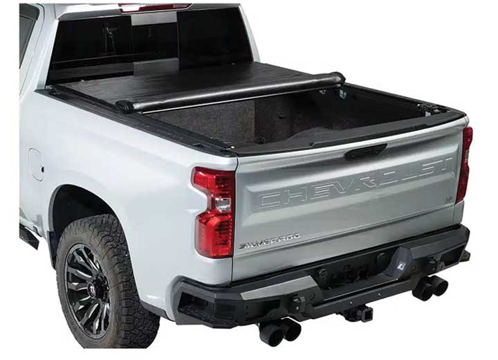 TruXedo Deuce soft folding tonneau cover folded partway open over the bed of a pickup truck, rear three-quarter view