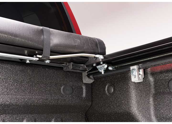 Close-up of the front hinge at the bulkhead on a TruXedo Deuce soft folding tonneau cover