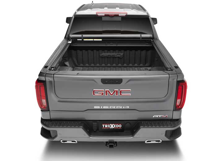 TruXedo Lo Pro soft roll-up tonneau cover rolled forward to the cab on a 2019-2024 GMC Sierra 1500, straight rear view