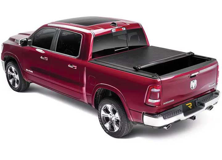 TruXedo Lo Pro soft roll-up tonneau cover rolled partway open on a 2019-2024 Ram 1500