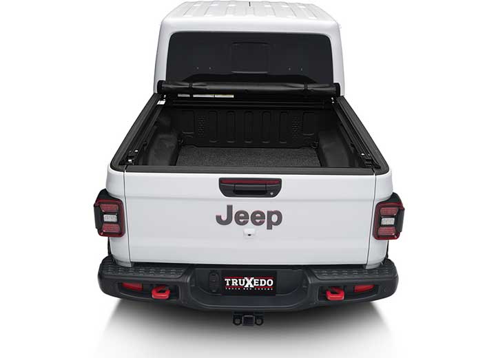 TruXedo Lo Pro soft roll-up tonneau cover rolled forward to the cab on a 2020-2024 Jeep Gladiator, straight rear view