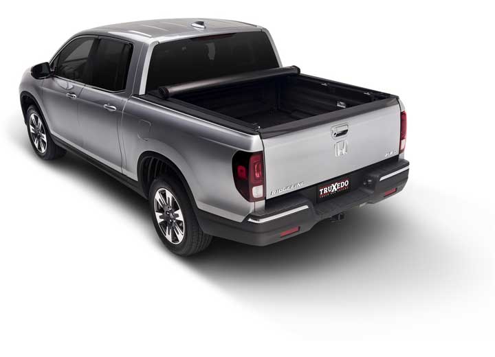 TruXedo Lo Pro soft roll-up tonneau cover rolled forward to the cab over the bed of a pickup truck, straight rear view
