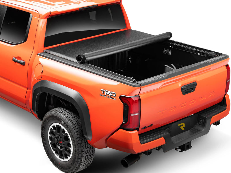 TruXedo Lo Pro soft roll-up tonneau cover rolled forward to the cab over the bed of a pickup truck, rear three-quarter view