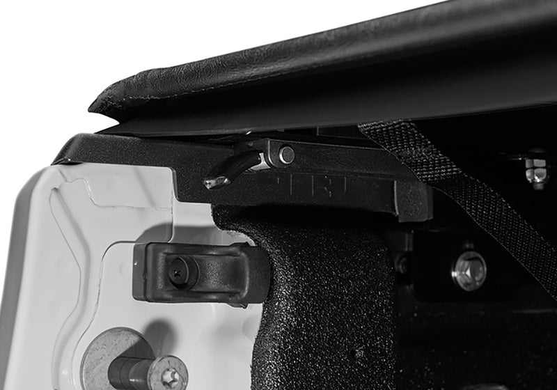 Close-up of the trigger latch at the rear corner on a TruXedo Lo Pro soft roll-up tonneau cover