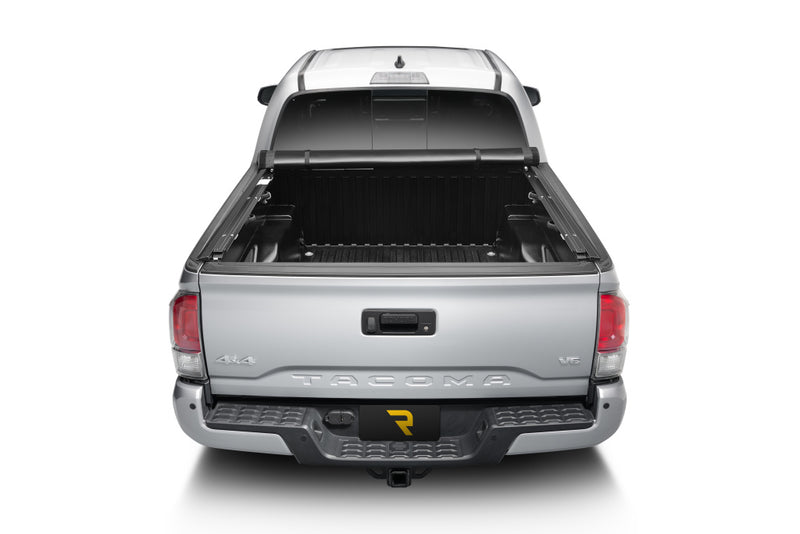 TruXedo Pro X15 soft roll-up tonneau cover rolled forward to the cab on a 2016-2023 Toyota Tacoma, straight rear view
