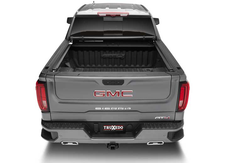 TruXedo Pro X15 soft roll-up tonneau cover rolled forward to the cab on a 2019-2024 GMC Sierra 1500, straight rear view