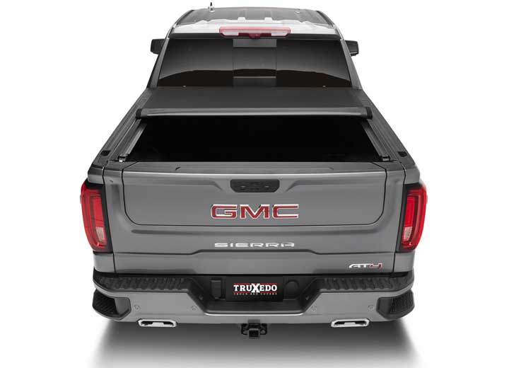 TruXedo Pro X15 soft roll-up tonneau cover rolled partway open on a 2019-2024 GMC Sierra 1500, straight rear view