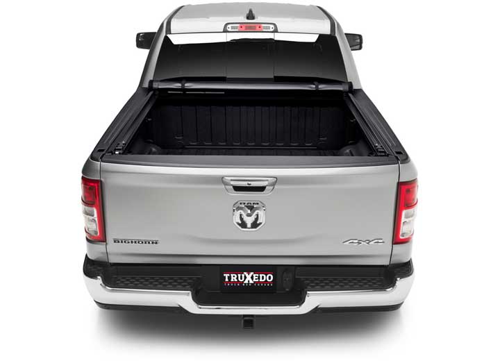 TruXedo Pro X15 soft roll-up tonneau cover rolled forward to the cab on a 2019-2024 Ram 1500, straight rear view
