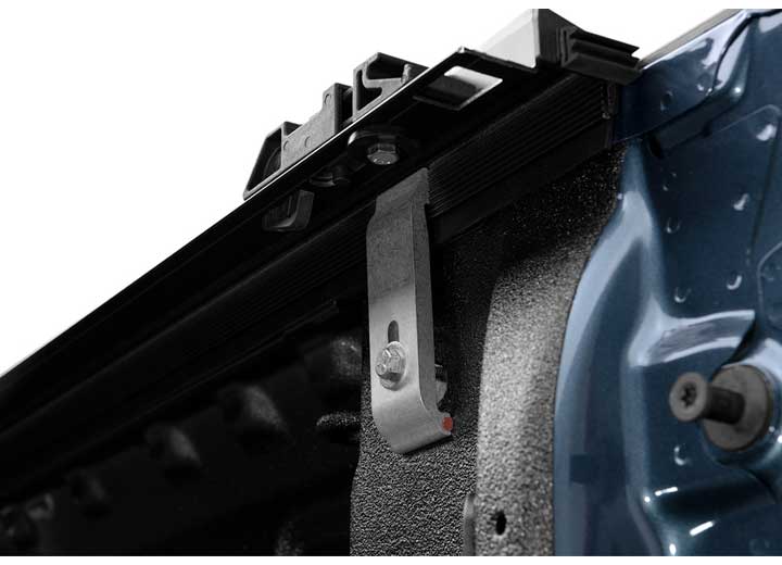 Close-up of the clamp where the side rail meets the bed on a TruXedo Pro X15 soft roll-up tonneau cover