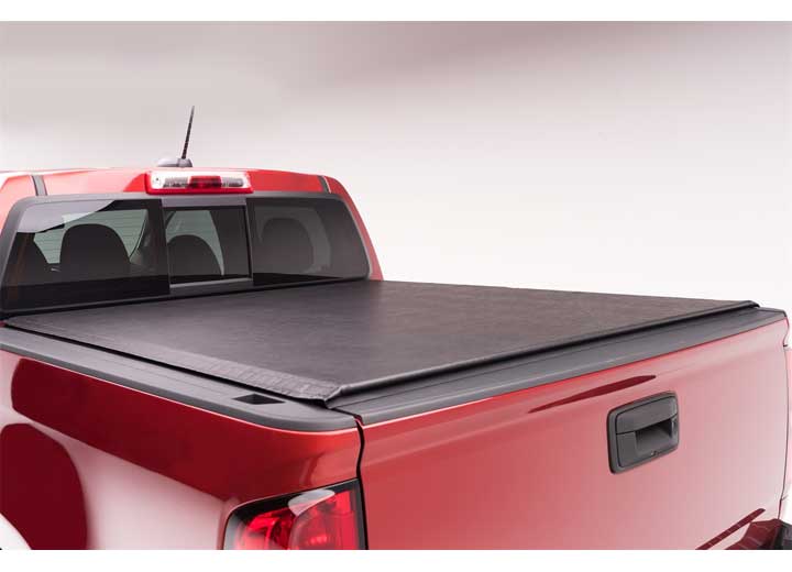 TruXedo Pro X15 soft roll-up tonneau cover closed over the bed of a pickup truck, straight rear view, against a plain studio backdrop
