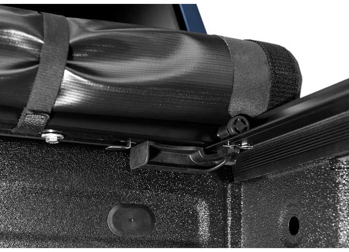 Close-up of the cover rolled up at the bulkhead on a TruXedo Pro X15 soft roll-up tonneau cover