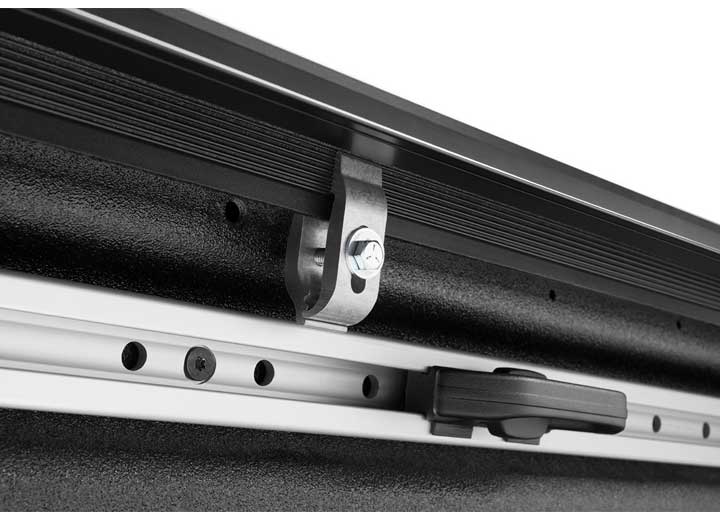 Close-up of the clamp hardware on a TruXedo Pro X15 soft roll-up tonneau cover