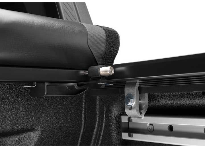 Close-up of the header rail at the tailgate on a TruXedo Pro X15 soft roll-up tonneau cover
