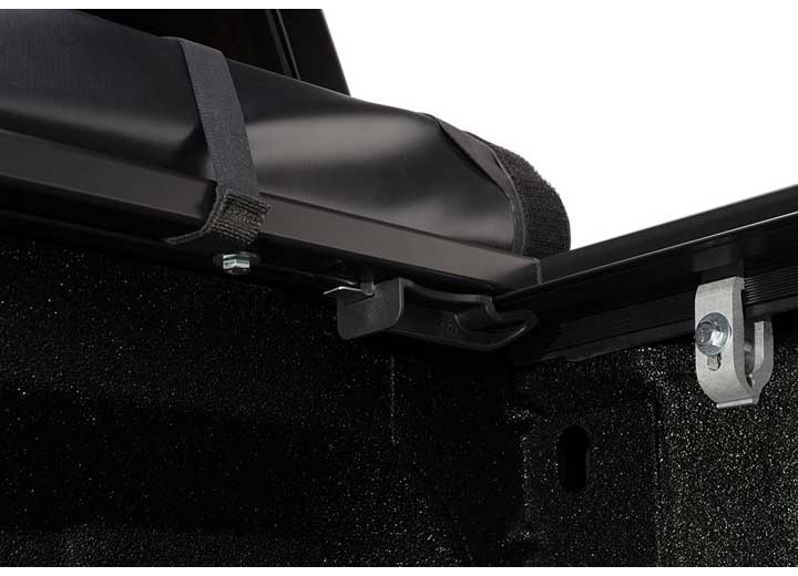 Close-up of the release lever at the rear corner on a TruXedo Pro X15 soft roll-up tonneau cover