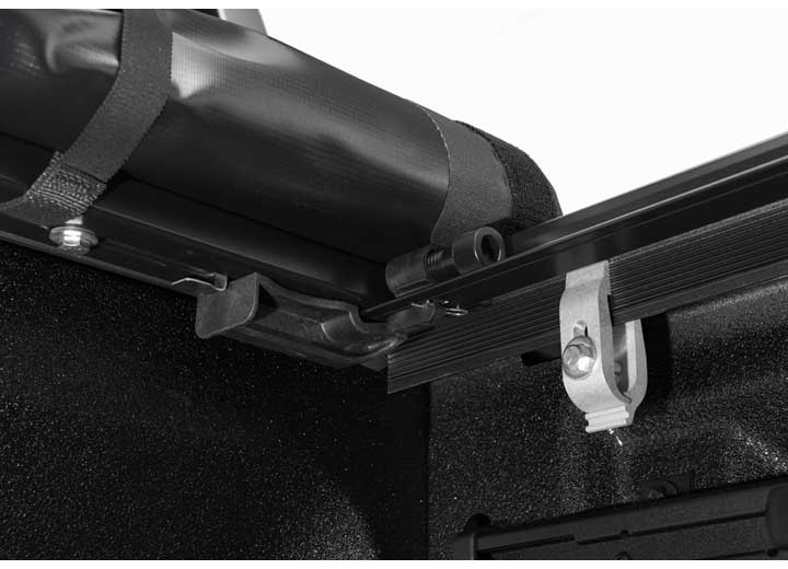Close-up of the release lever at the rear corner on a TruXedo Pro X15 soft roll-up tonneau cover