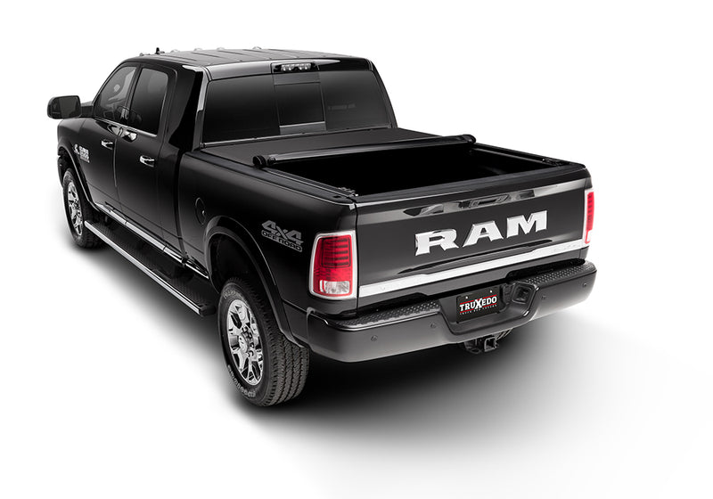 TruXedo Pro X15 soft roll-up tonneau cover rolled partway open over the bed of a pickup truck