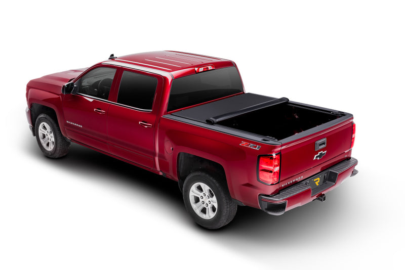 TruXedo Pro X15 soft roll-up tonneau cover rolled partway open over the bed of a pickup truck
