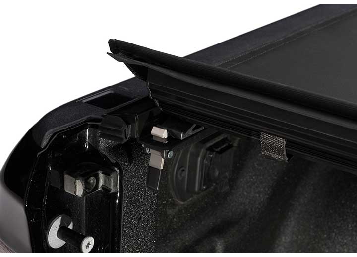 Close-up of the trigger latch at the rear corner on a TruXedo Pro X15 soft roll-up tonneau cover