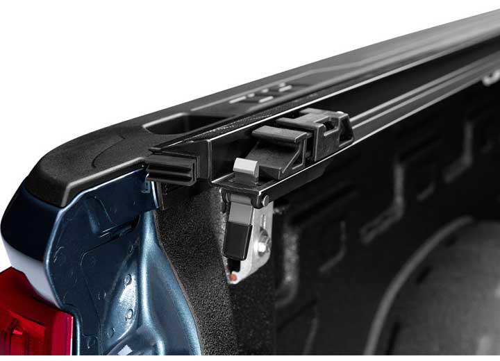 Close-up of the trigger latch at the rear corner on a TruXedo Pro X15 soft roll-up tonneau cover