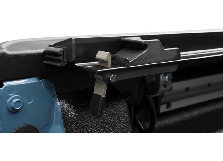 Close-up of the trigger latch at the rear corner on a TruXedo Pro X15 soft roll-up tonneau cover