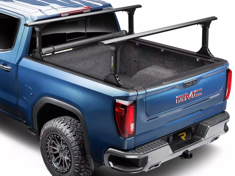 Pro X15 TS fully rolled up against the cab for full bed access; the bed rack is shown for illustration and is sold separately