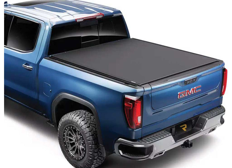 TruXedo Pro X15 TS soft roll-up tonneau cover closed over the bed of a pickup truck, rear three-quarter view, widest view