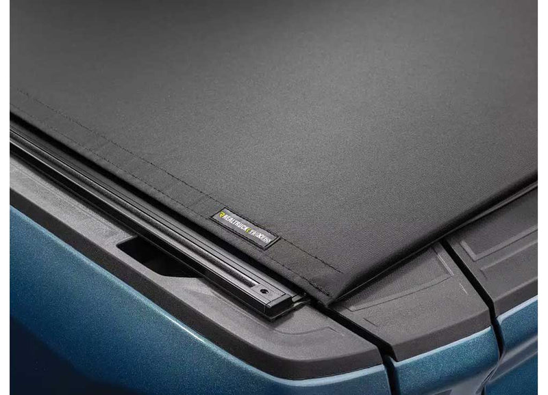 Close-up of the corner where the cover meets the side rail and its mounting track on a TruXedo Pro X15 TS soft roll-up tonneau cover