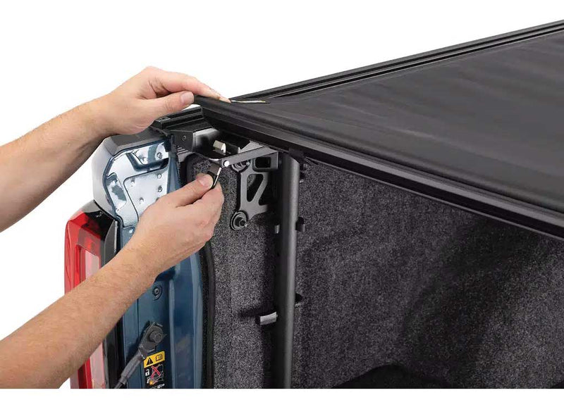 Close-up of the cover being drawn along the side rail as it unrolls on a TruXedo Pro X15 TS soft roll-up tonneau cover