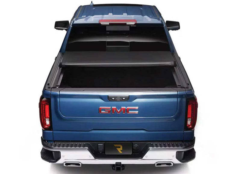 TruXedo Pro X15 TS soft roll-up tonneau cover rolled forward to the cab over the bed of a pickup truck, straight rear view