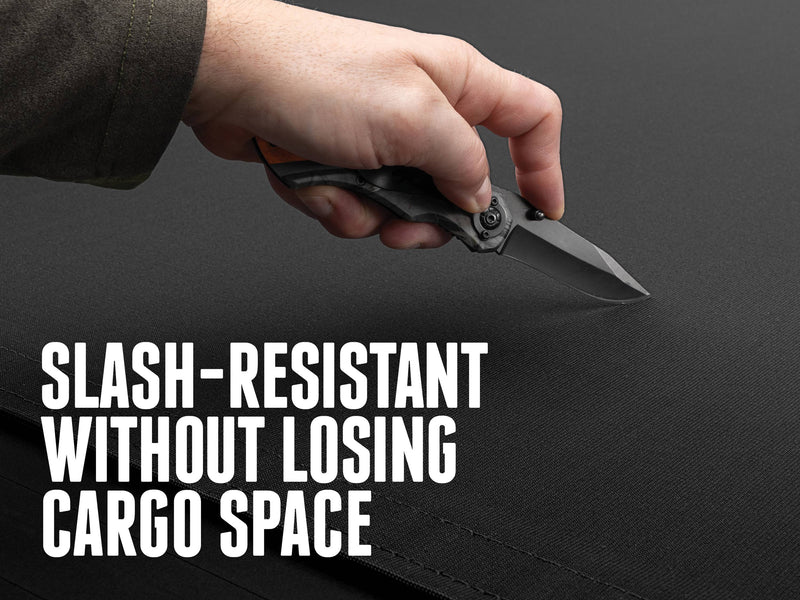 A knife held against the Sentry CT canvas top, with the text Slash-resistant without losing cargo space