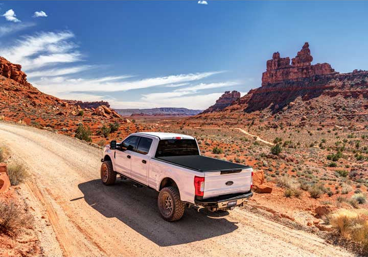 TruXedo Sentry CT hard roll-up tonneau cover closed on a pickup bed on a red rock desert road