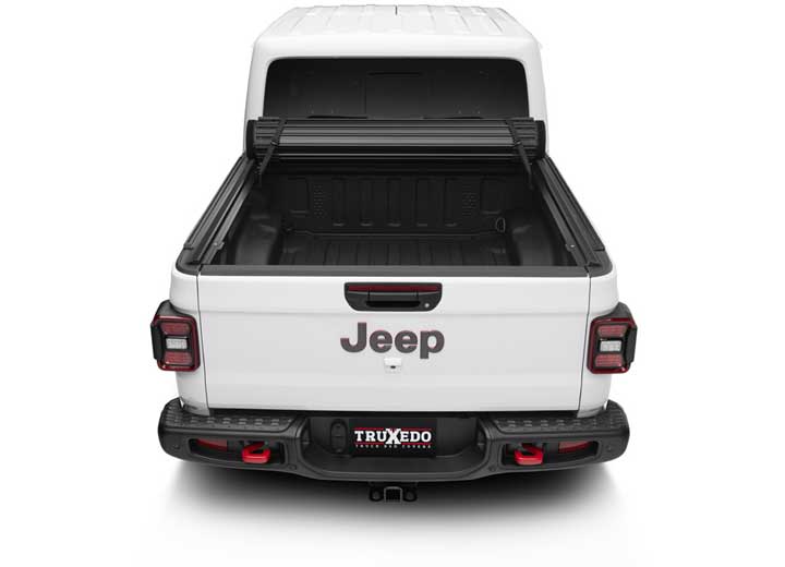 TruXedo Sentry CT hard roll-up tonneau cover rolled forward to the cab on a 2020-2024 Jeep Gladiator, straight rear view