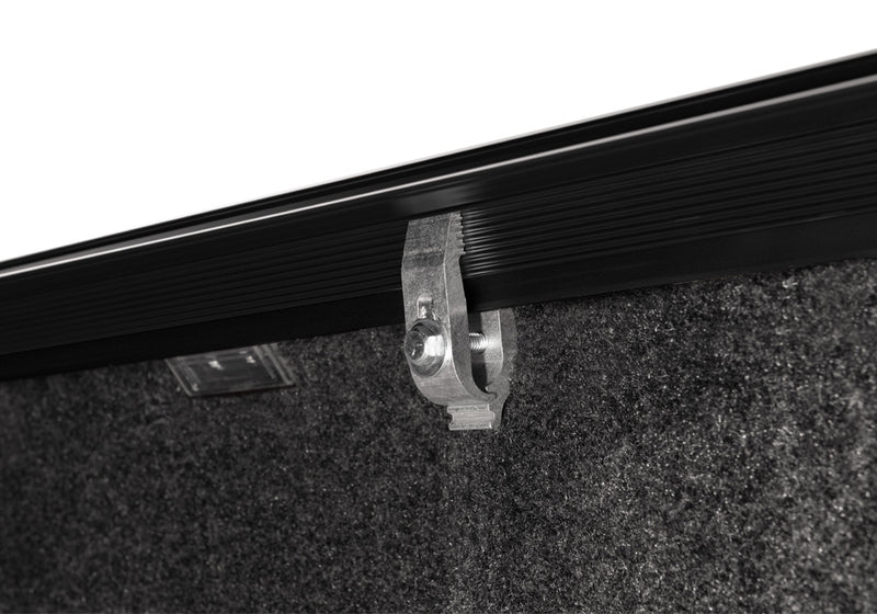 Close-up of the clamp hardware on a TruXedo Sentry CT hard roll-up tonneau cover