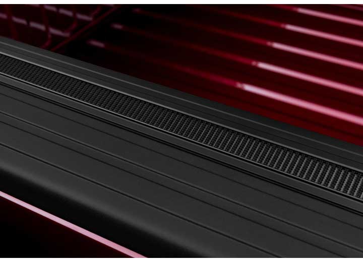 Close-up of the hook-and-loop fastening along the side rail on a TruXedo Sentry CT hard roll-up tonneau cover