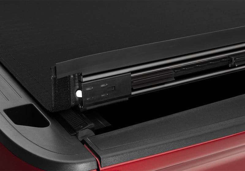 Close-up of the latch and tensioning mechanism on a TruXedo Sentry CT hard roll-up tonneau cover