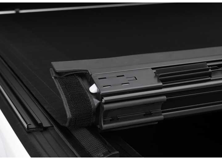 Close-up of the latch and tensioning mechanism on a TruXedo Sentry CT hard roll-up tonneau cover