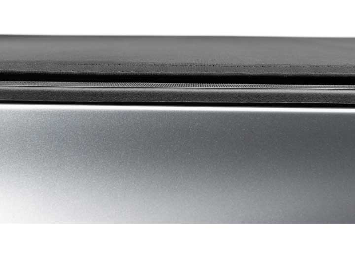Close-up of the side rail on a TruXedo Sentry CT hard roll-up tonneau cover