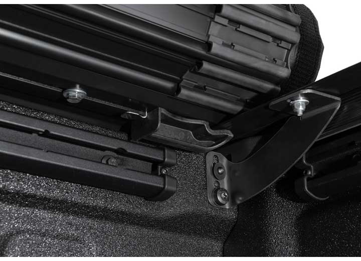Close-up of the release lever at the rear corner on a TruXedo Sentry CT hard roll-up tonneau cover
