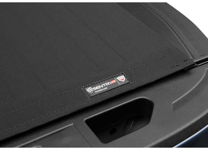 Close-up of the TruXedo name plate on the cover on a TruXedo Sentry CT hard roll-up tonneau cover