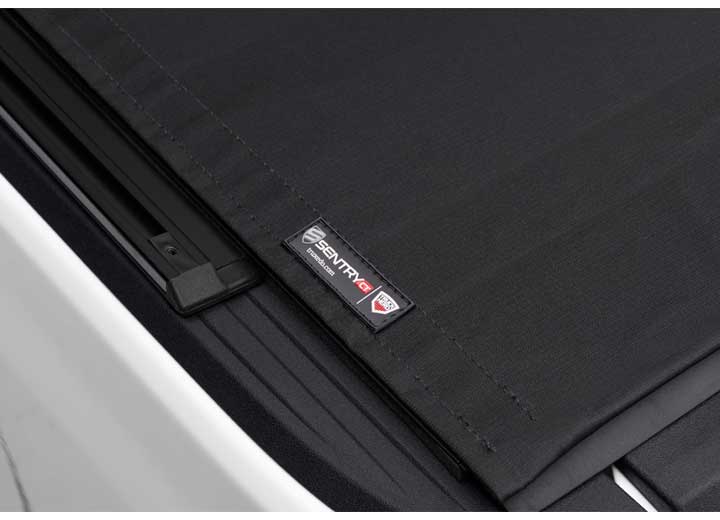 Close-up of the TruXedo name plate on the cover on a TruXedo Sentry CT hard roll-up tonneau cover