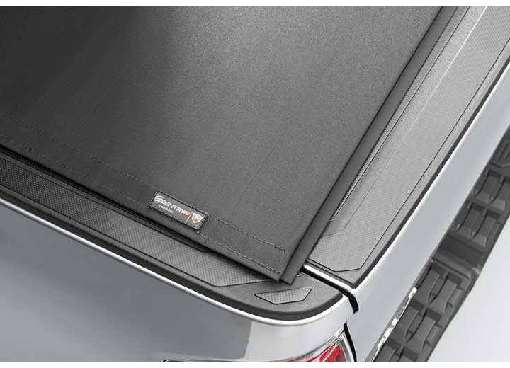 Close-up of the TruXedo name plate on the cover on a TruXedo Sentry CT hard roll-up tonneau cover