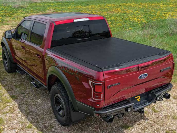 TruXedo Sentry hard roll-up tonneau cover closed on a pickup bed in a wildflower field
