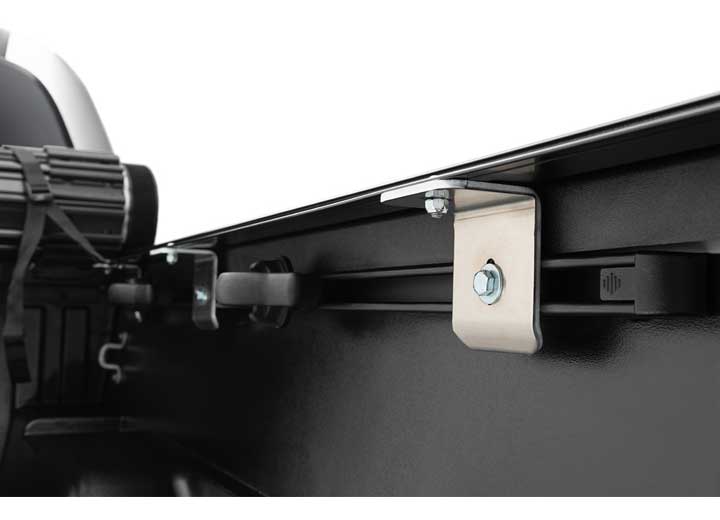 Close-up of the clamp hardware on a TruXedo Sentry hard roll-up tonneau cover