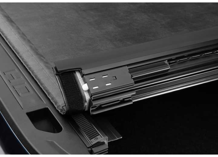 Close-up of the latch at the tailgate header on a TruXedo Sentry hard roll-up tonneau cover