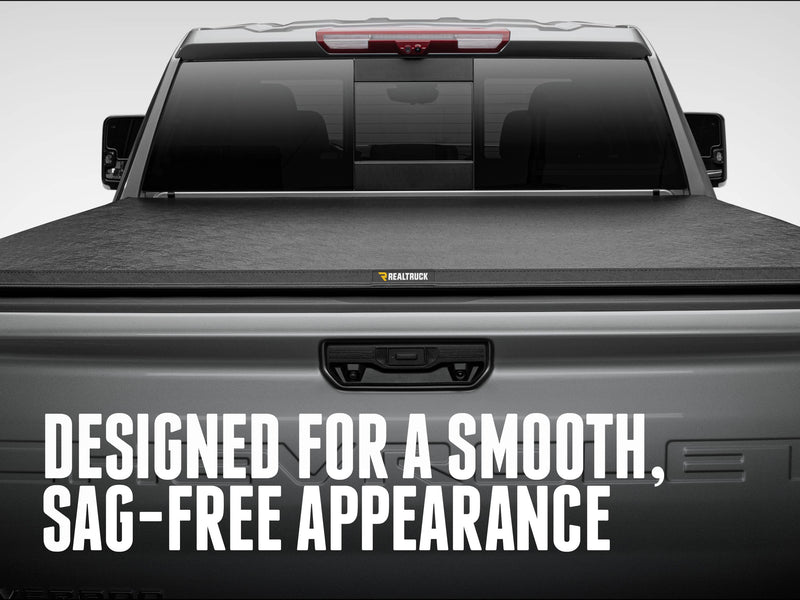 Rear view of the closed TruXport lying flat and smooth across the bed, with the text Designed for a smooth, sag-free appearance