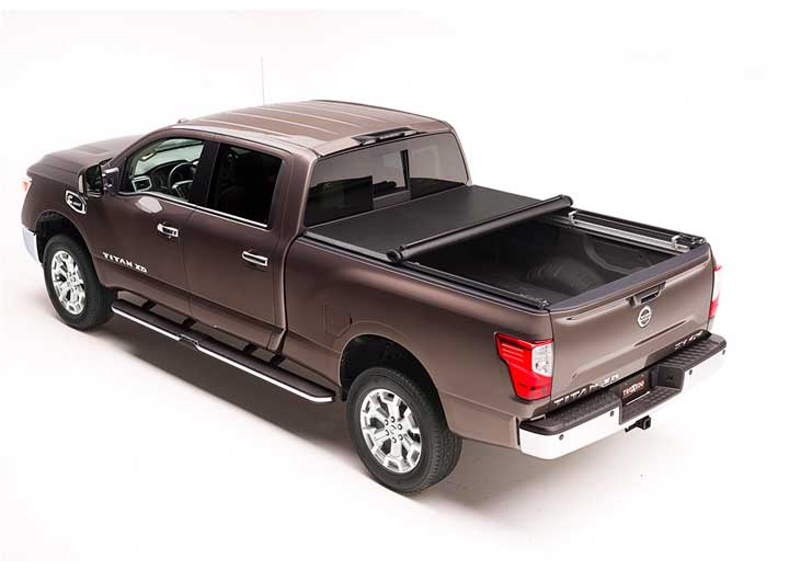 TruXedo TruXport soft roll-up tonneau cover rolled partway open on a 2004-2015 Nissan Titan
